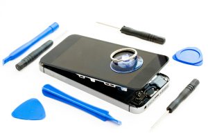 Device repairs with a damaged mobile or cell phone with all the tools needed to repair it